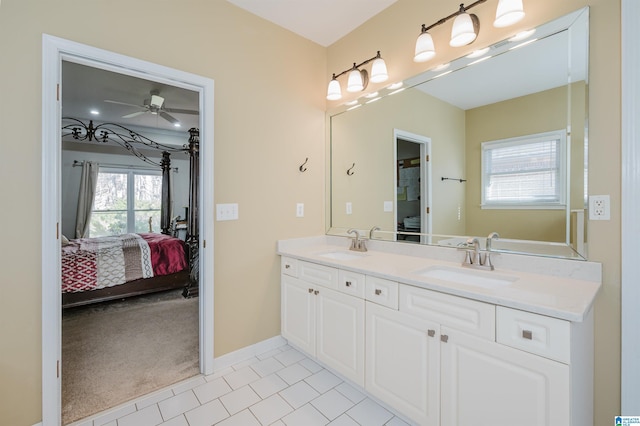 bathroom featuring vanity, tile patterned floors, and ceiling fan