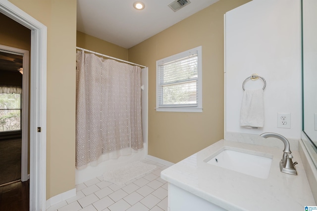 bathroom with vanity, tile patterned flooring, and shower / bath combination with curtain