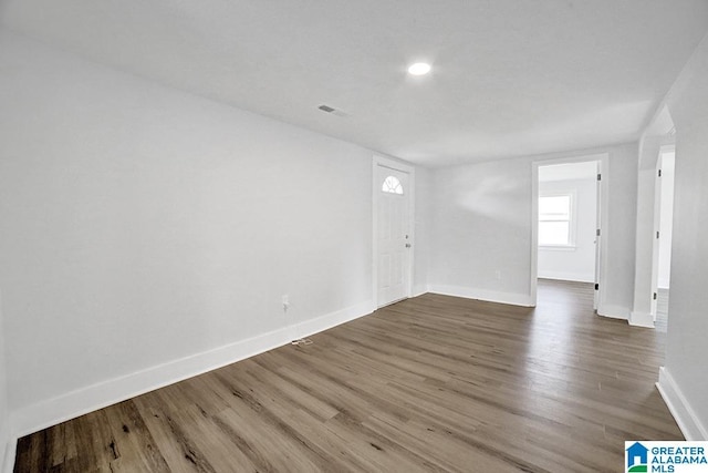 spare room featuring hardwood / wood-style flooring