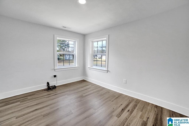 spare room featuring hardwood / wood-style flooring