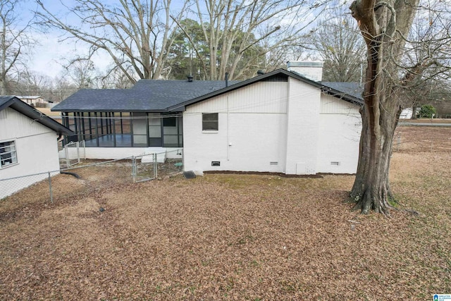 rear view of house with a sunroom