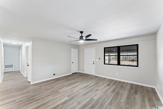 unfurnished room with ceiling fan and light hardwood / wood-style flooring