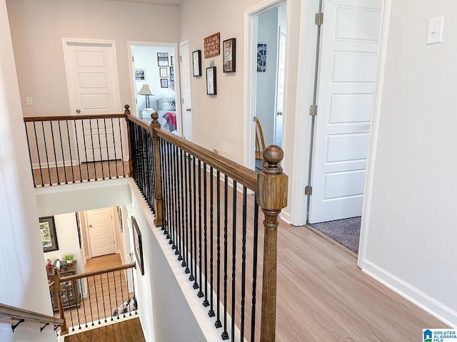 stairs featuring hardwood / wood-style flooring