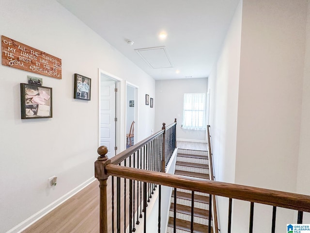 corridor with light hardwood / wood-style floors