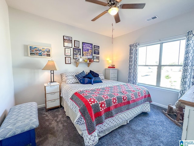 bedroom featuring ceiling fan and dark colored carpet