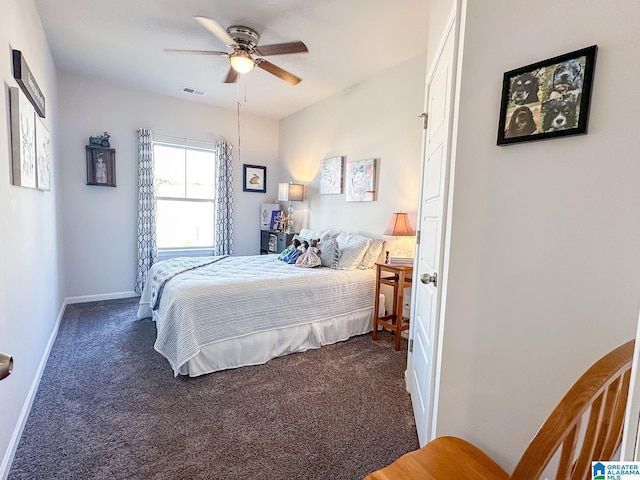 bedroom with ceiling fan and dark colored carpet