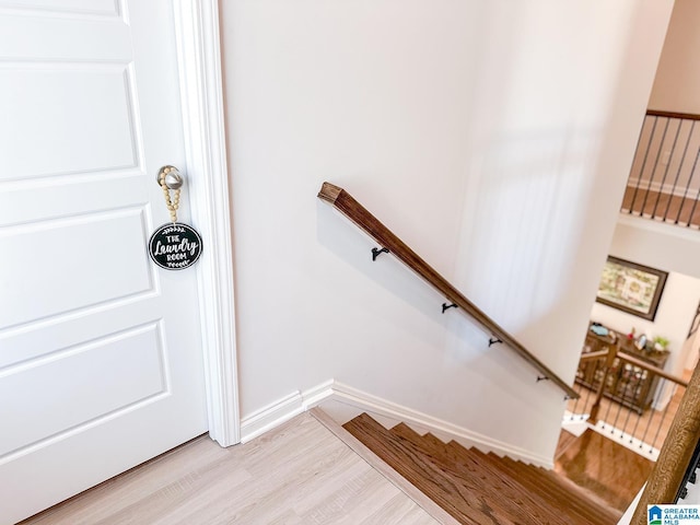 stairway with wood-type flooring