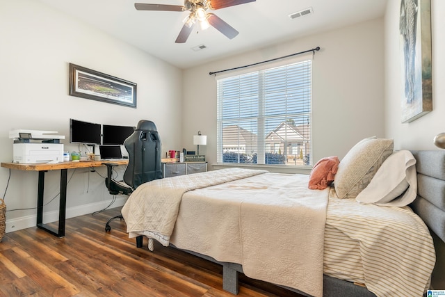 bedroom featuring ceiling fan and dark hardwood / wood-style flooring