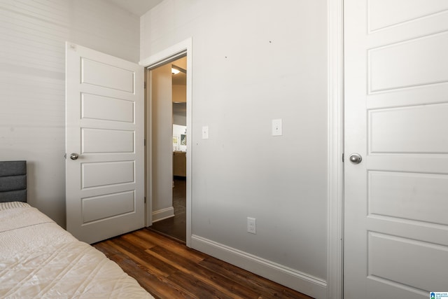 bedroom featuring dark hardwood / wood-style flooring