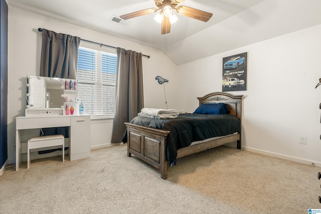 carpeted bedroom featuring vaulted ceiling and ceiling fan