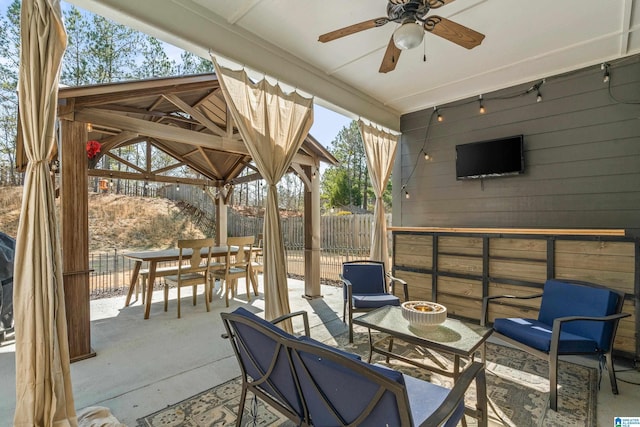 view of patio / terrace featuring ceiling fan