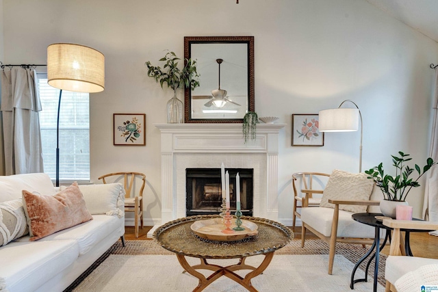 living room with ceiling fan and light wood-type flooring