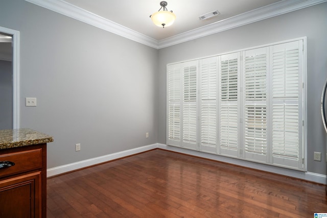 unfurnished dining area with crown molding and dark hardwood / wood-style floors