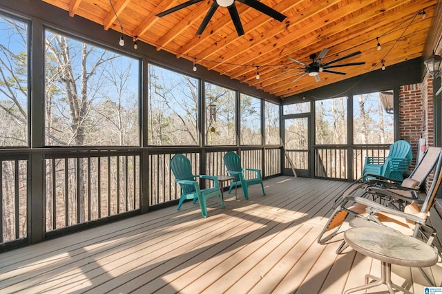 sunroom / solarium with wood ceiling and track lighting