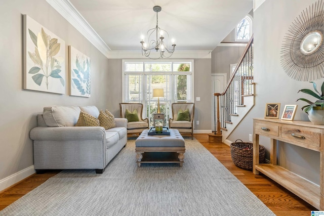 sitting room with an inviting chandelier, ornamental molding, and wood-type flooring