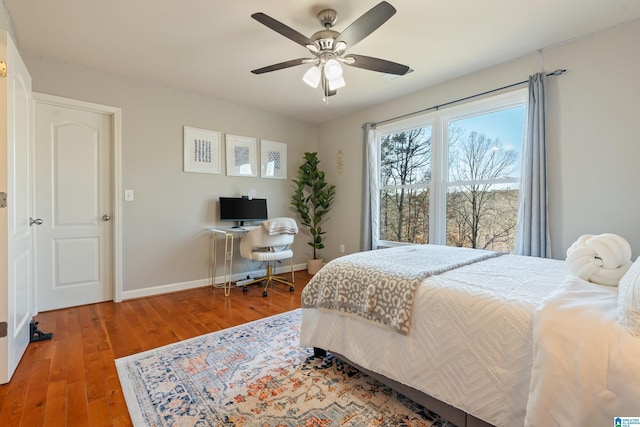 bedroom featuring wood-type flooring and ceiling fan