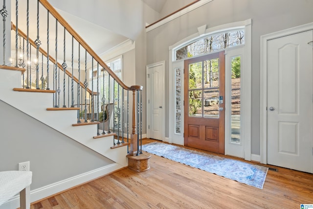 entryway with hardwood / wood-style flooring