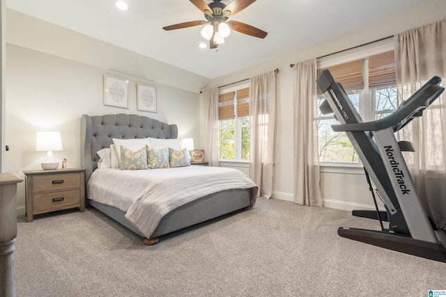 carpeted bedroom featuring lofted ceiling and ceiling fan