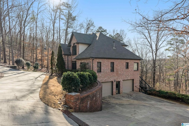 view of side of property with a garage