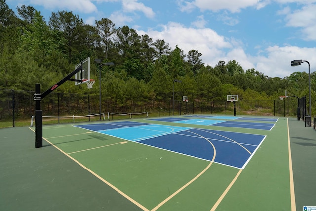 view of sport court featuring tennis court