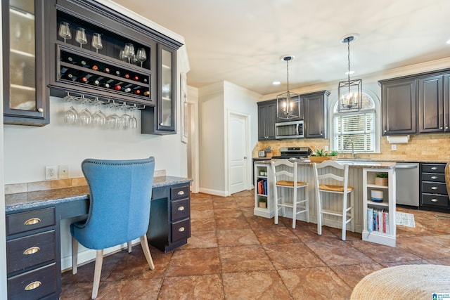 interior space with ornamental molding, built in desk, and sink