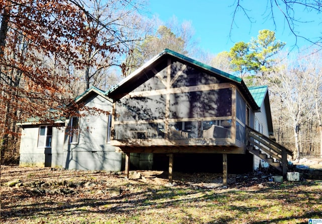 back of property featuring a deck