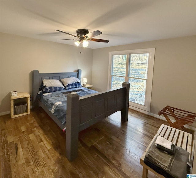 bedroom featuring dark wood-type flooring and ceiling fan