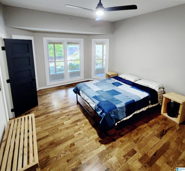 bedroom featuring ceiling fan and hardwood / wood-style floors