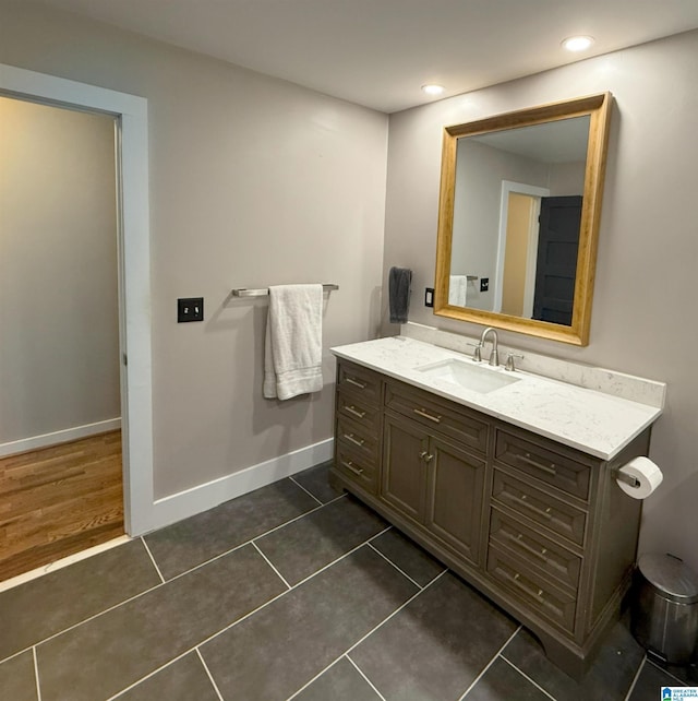 bathroom featuring tile patterned flooring and vanity