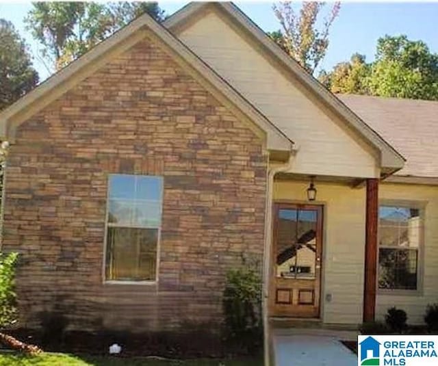 view of front of home with stone siding