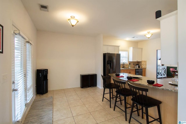 tiled dining area with sink