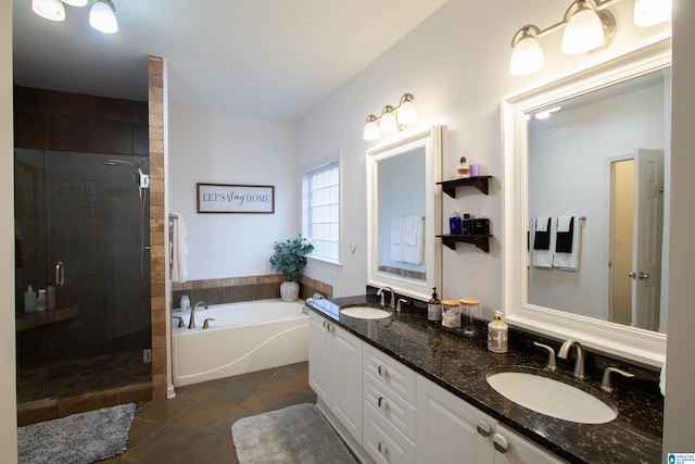 bathroom with plus walk in shower, vanity, and tile patterned floors