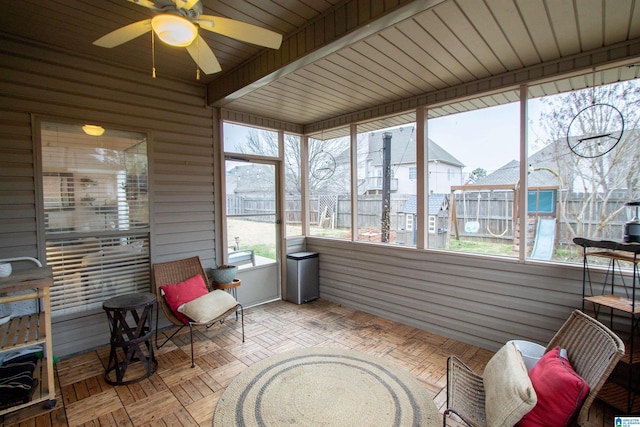 sunroom with ceiling fan