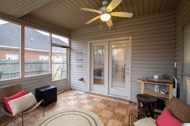 sunroom / solarium with ceiling fan