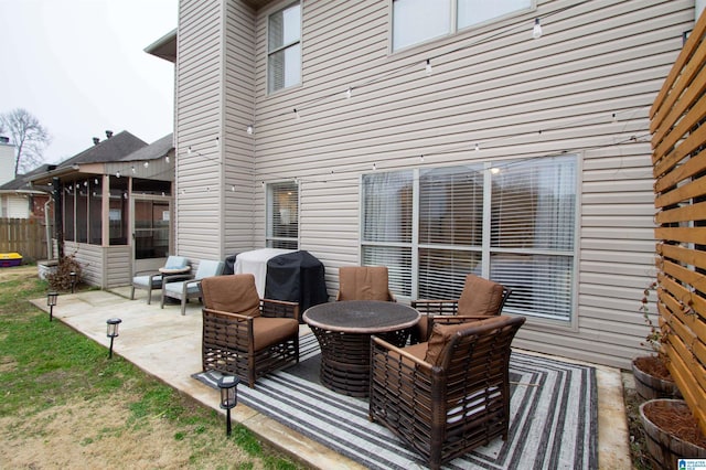 view of patio / terrace with a sunroom