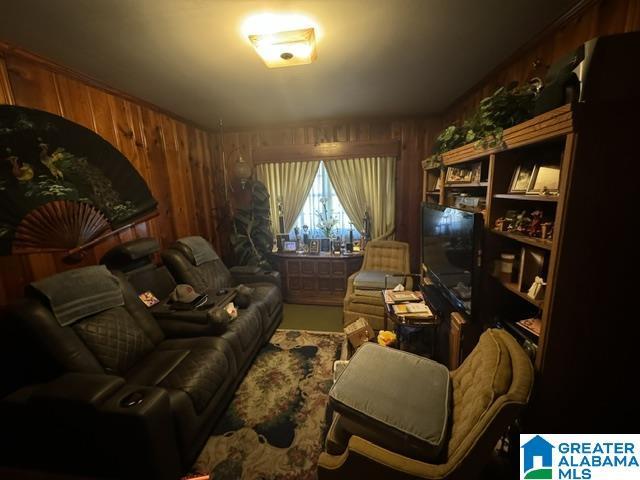 living area featuring wooden walls