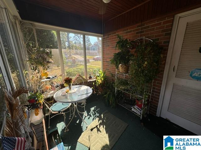 sunroom with wooden ceiling