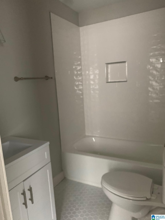 full bathroom with vanity, tile patterned floors, bathing tub / shower combination, and toilet