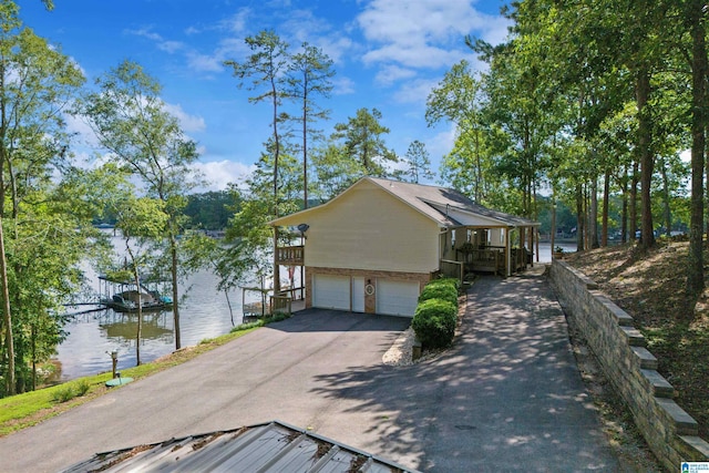 373 Pineywoods Dr, Wedowee, AL 36278 - view of side of property featuring a garage and a water view