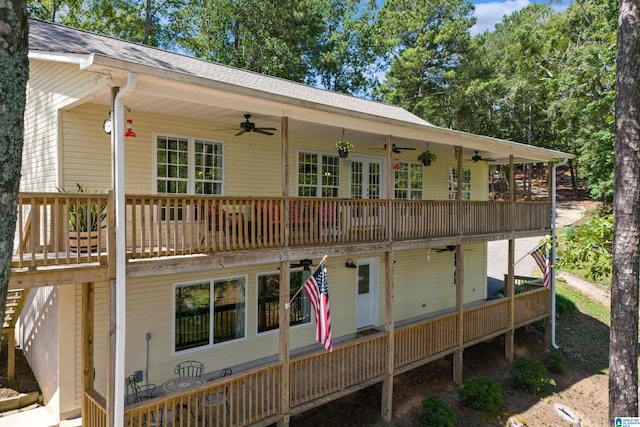 rear view of property with ceiling fan