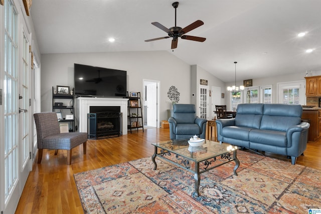 373 Pineywoods Dr, Wedowee, AL 36278 - living room featuring ceiling fan with notable chandelier, lofted ceiling, and hardwood / wood-style floors