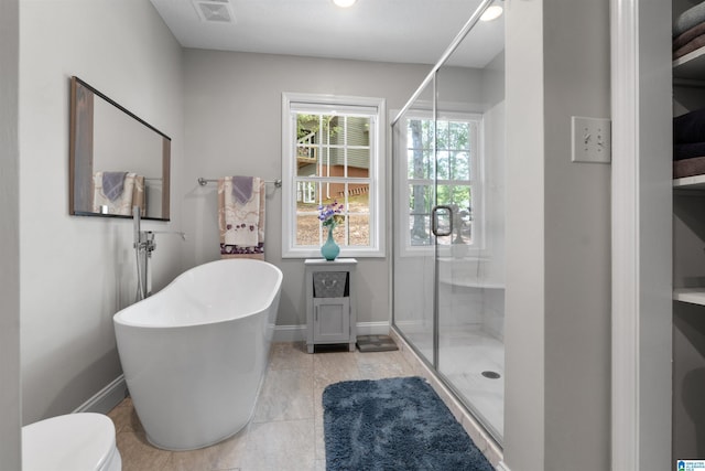 373 Pineywoods Dr, Wedowee, AL 36278 - bathroom featuring tile patterned flooring, independent shower and bath, and toilet