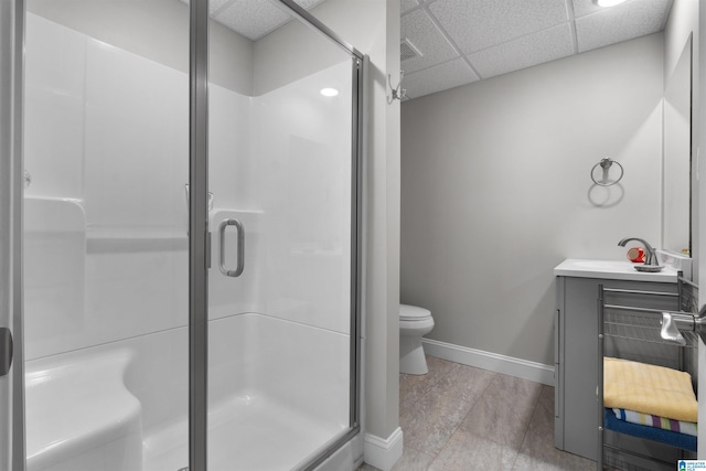 373 Pineywoods Dr, Wedowee, AL 36278 - bathroom with vanity, toilet, a paneled ceiling, and a shower with shower door