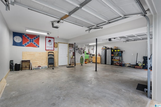373 Pineywoods Dr, Wedowee, AL 36278 - garage featuring a garage door opener and stainless steel refrigerator