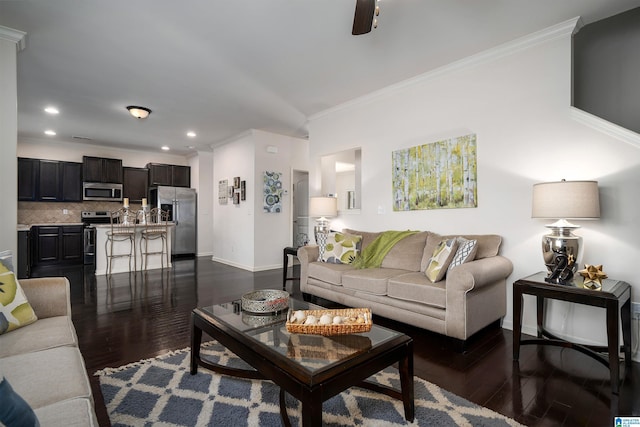 living room with ornamental molding and dark hardwood / wood-style flooring