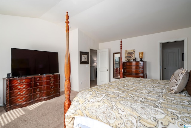 carpeted bedroom with lofted ceiling