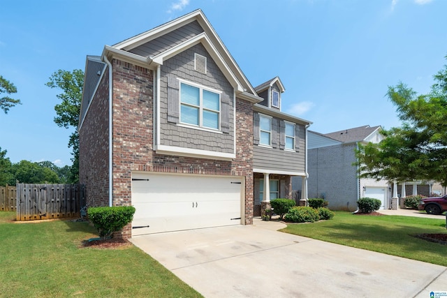 craftsman inspired home featuring a garage and a front lawn