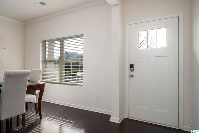 foyer featuring crown molding and dark hardwood / wood-style flooring