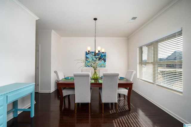 dining space featuring a notable chandelier, crown molding, and dark wood-type flooring