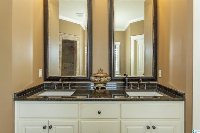 bathroom with crown molding and vanity